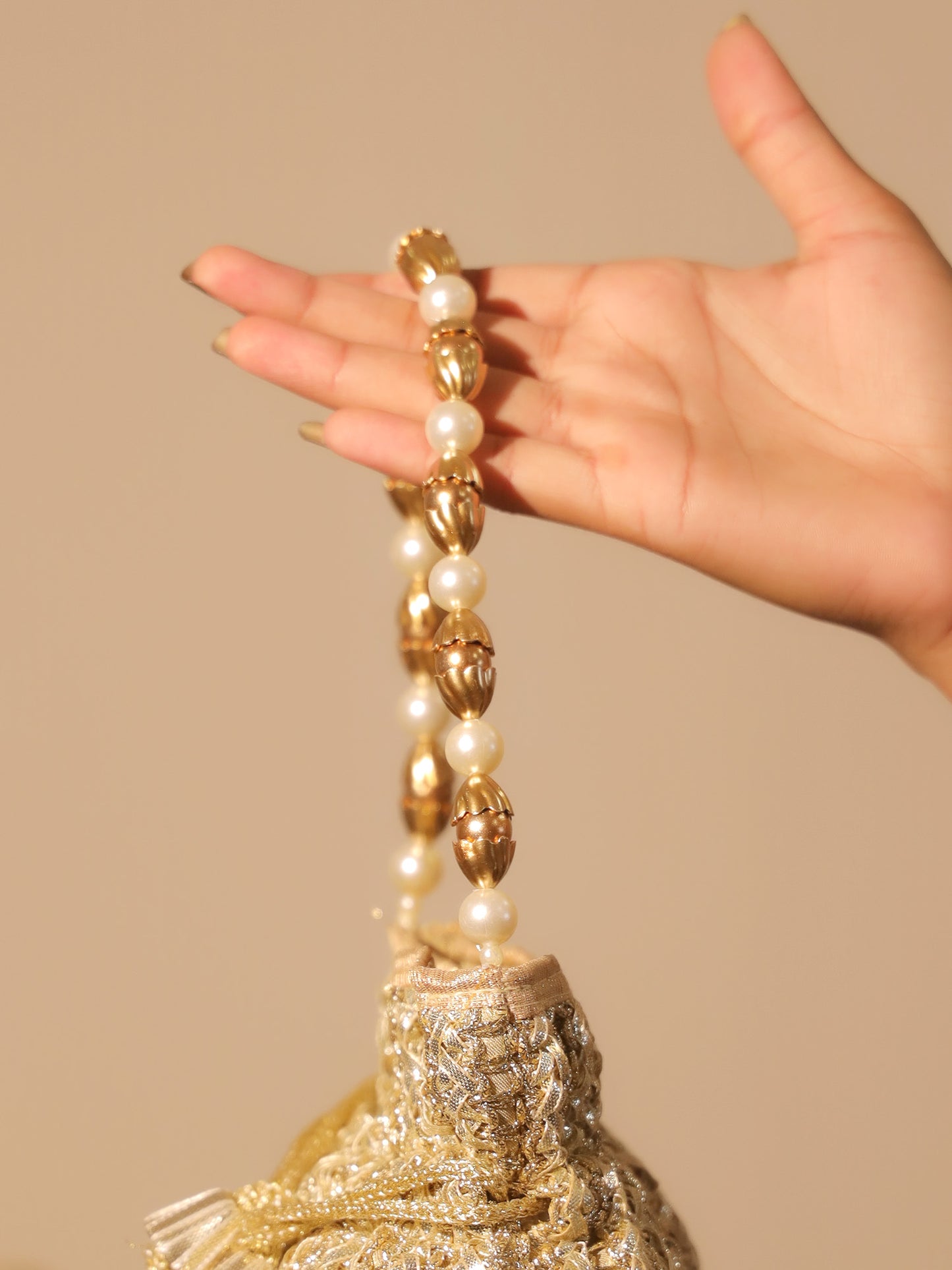 Naysa Golden Potli Bag