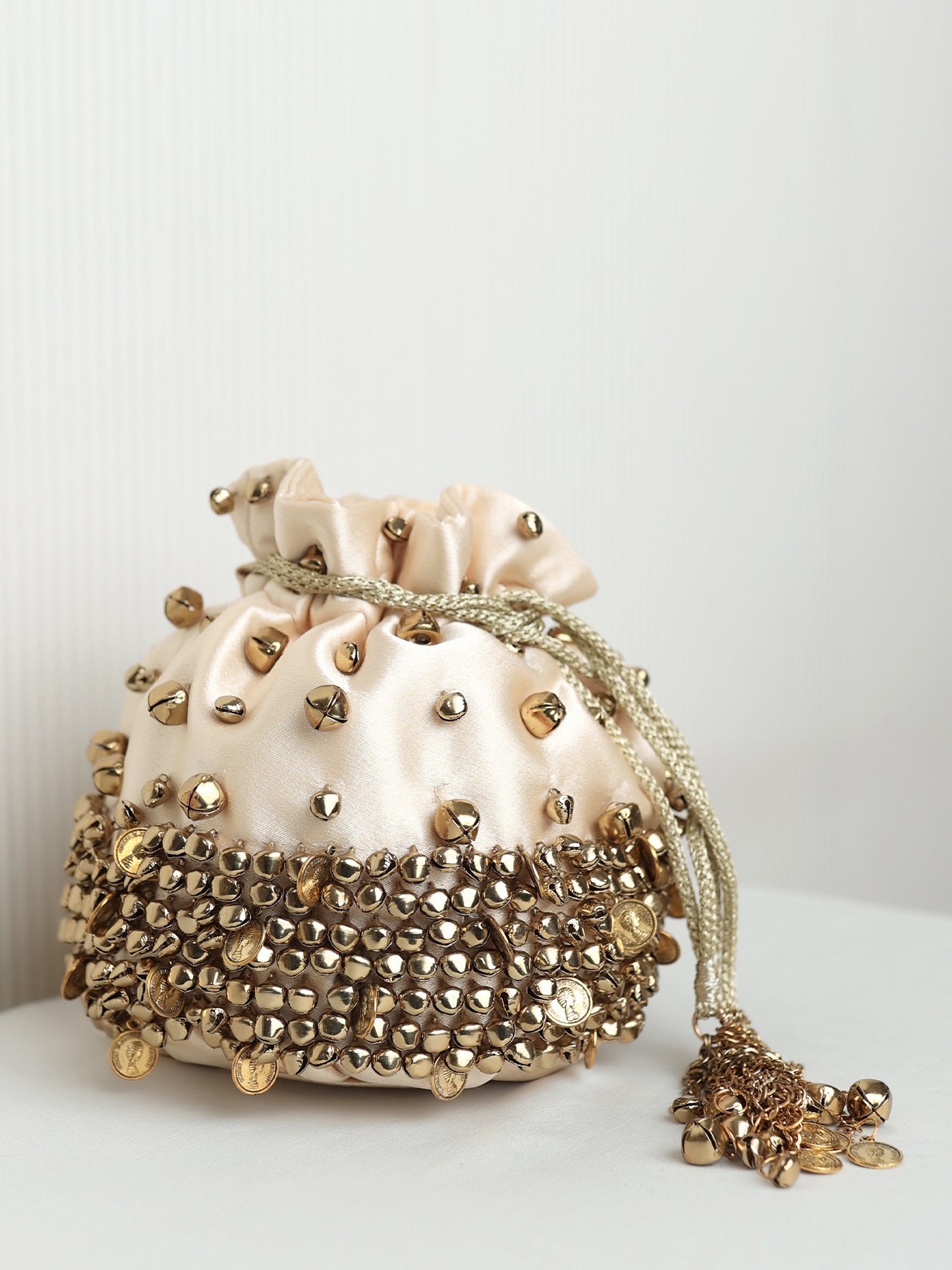 Nivriti Ivory Royale Heavy Ghungroo Coin Potli Bag