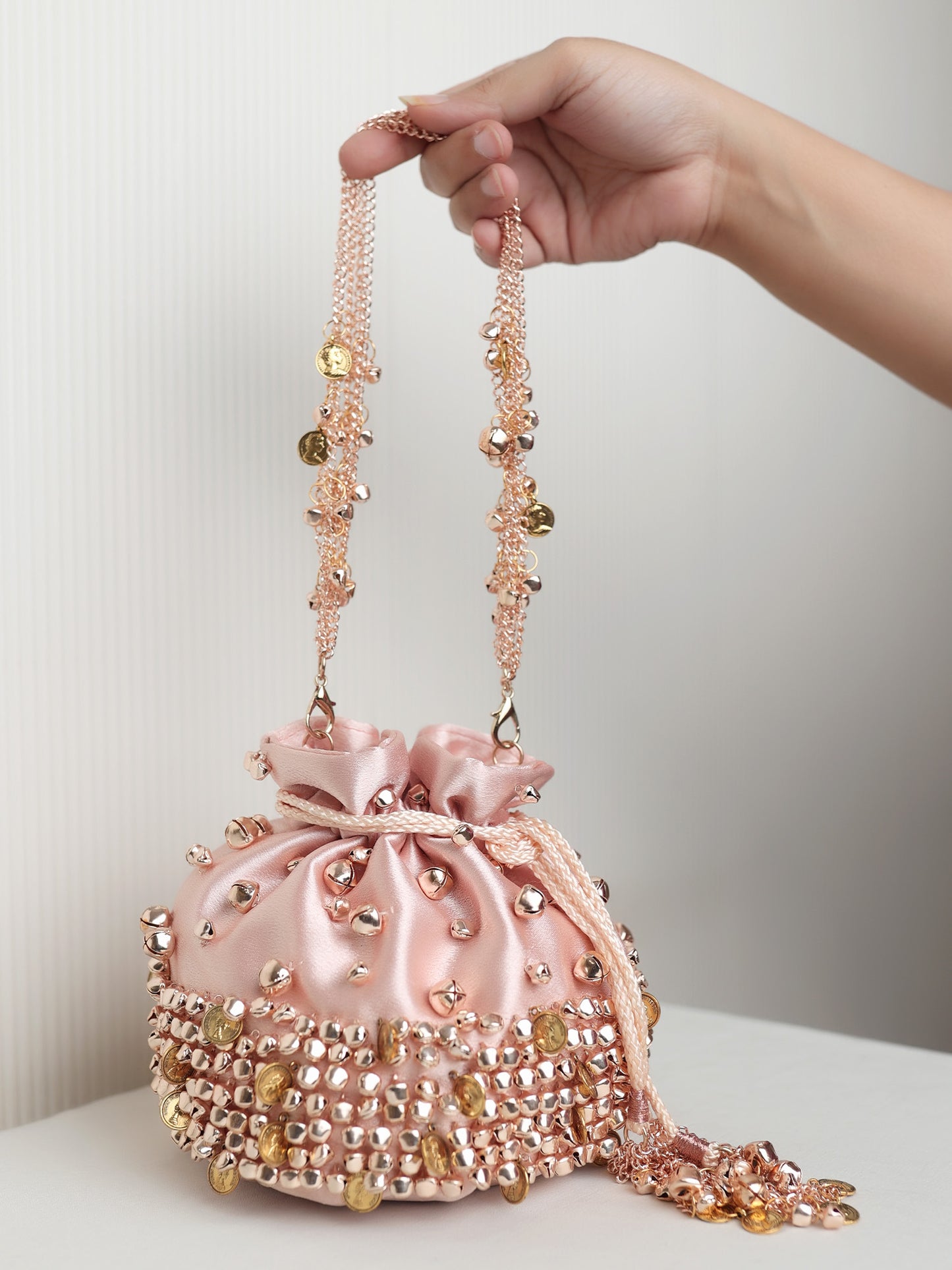 Kaaynaat Baby Pink Rose Gold Heavy Ghungroo Coin Potli Bag