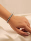 Fluid Emerald American Diamond Bracelet