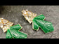 Diya Green Rhodium Plated Carved Stone Kundan Earrings